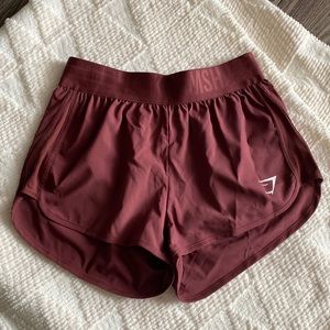 NWT training loose fit shorts. Cherry brown.